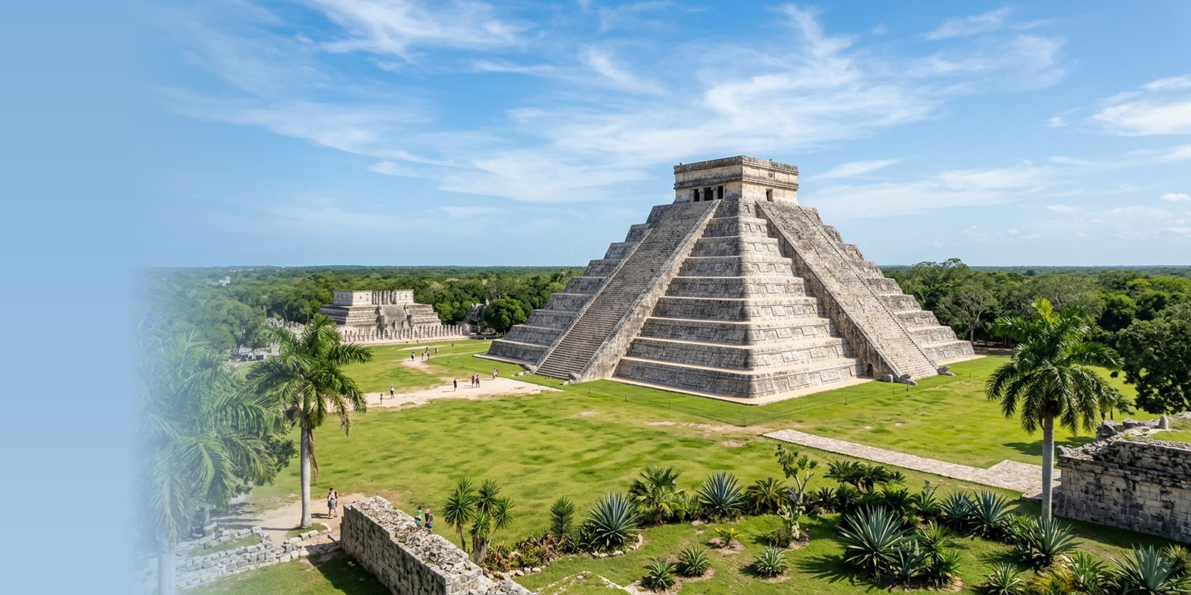 The iconic El Castillo pyramid at Chichen Itza Mayan ruins under bright blue skies